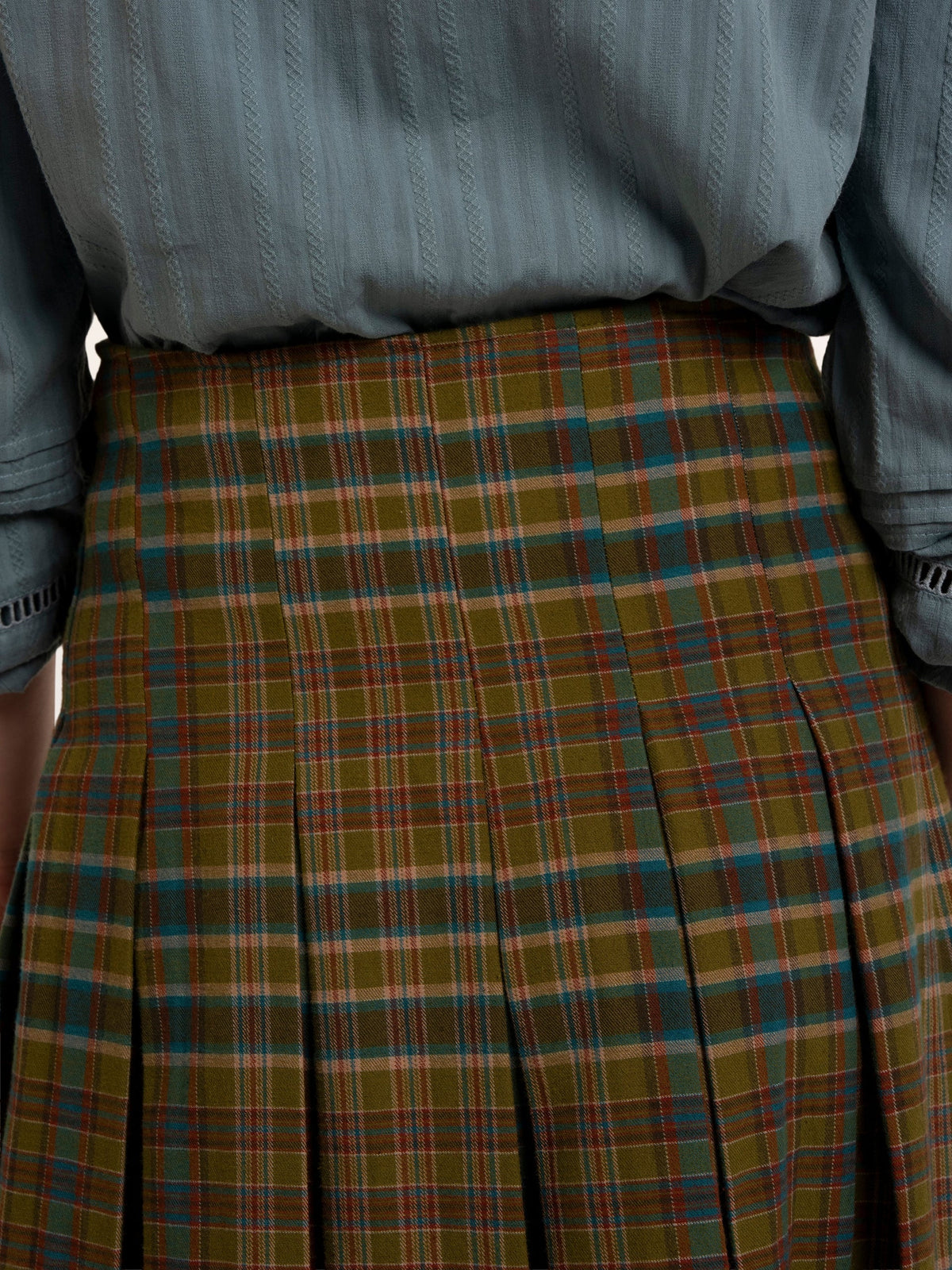 Brakeburn Red Cedar Check Pleated Kilt Skirt styled with a cream cable knit jumper and brown boots