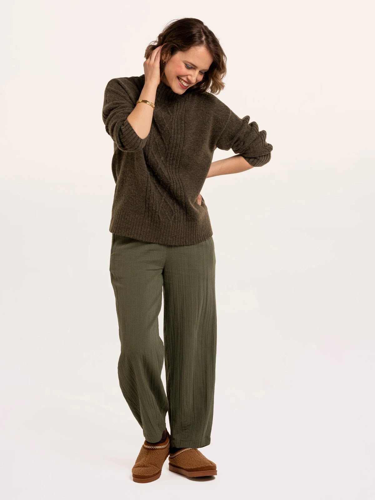 Brakeburn Signe Stitch Detail Knitted Roll Neck Jumper in olive green styled with burgundy corduroy trousers