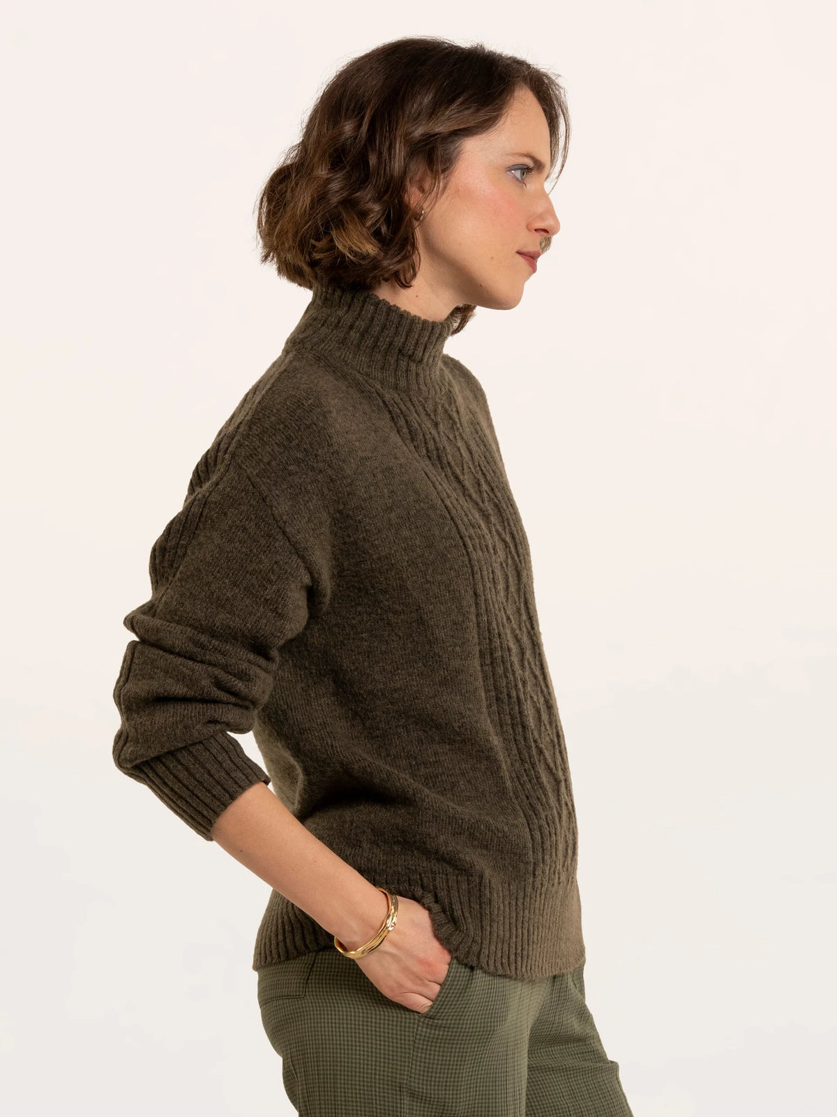Brakeburn Signe Stitch Detail Knitted Roll Neck Jumper in olive green styled with burgundy corduroy trousers