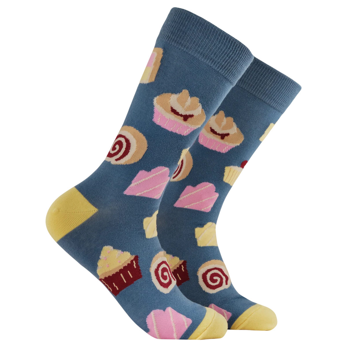 Socktopus Cake Lover socks featuring a colourful pattern of cakes, cupcakes, and rolls on a blue background with yellow heels and toes