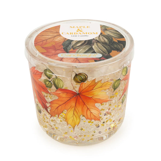 Candlelight Maple and Cardamom flameless LED candle in a printed clear glass holder featuring autumn leaf artwork and sparkling gel