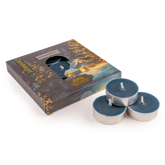 Candlelight Starlit Night Sky set of 9 deep blue scented tealights shown beside their illustrated starry winter cottage gift box