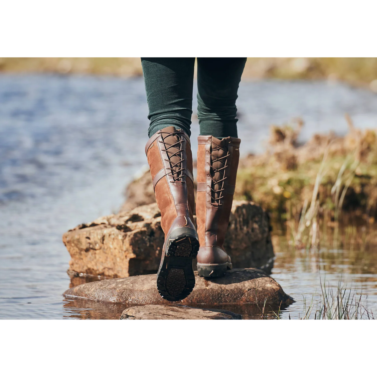 Pair of Dubarry Glanmire ladies waterproof country boots in walnut brown leather showing rear bungee calf adjustment laces