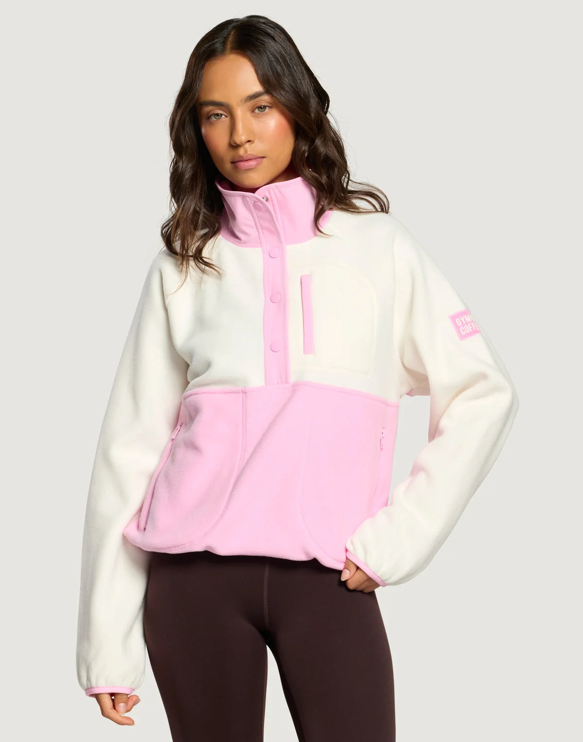 Front view of the Gym + Coffee Snap Polar Fleece featuring a snap collar and zip side pockets.