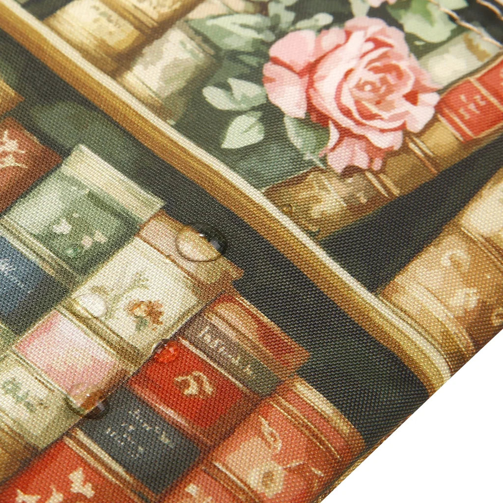Eco Chic lightweight foldable mini backpack featuring vintage Books and Roses library pattern with side mesh pockets
