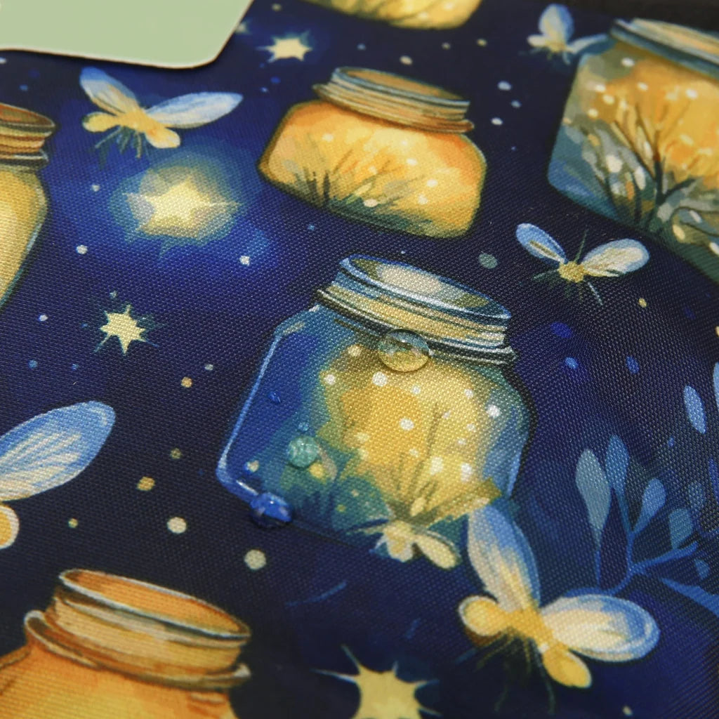 Eco Chic lightweight foldable crossbody sling bag featuring glowing jars and fireflies pattern on navy blue fabric