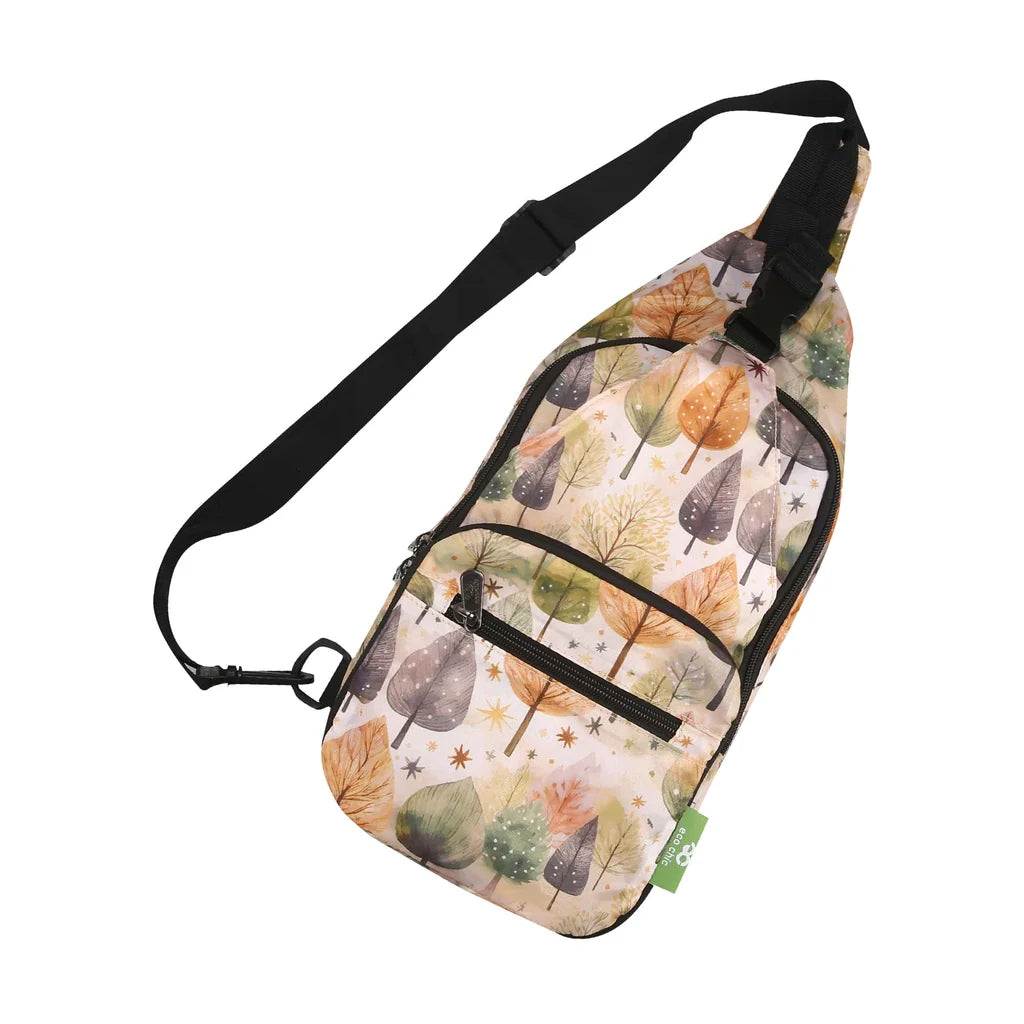 Eco Chic lightweight foldable crossbody sling bag featuring warm autumnal Rhythm of Trees pattern and black webbing strap