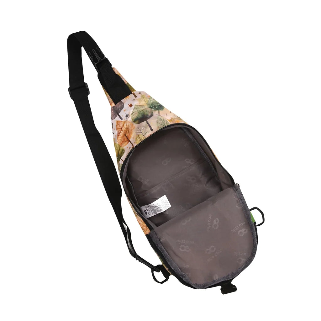 Eco Chic lightweight foldable crossbody sling bag featuring warm autumnal Rhythm of Trees pattern and black webbing strap