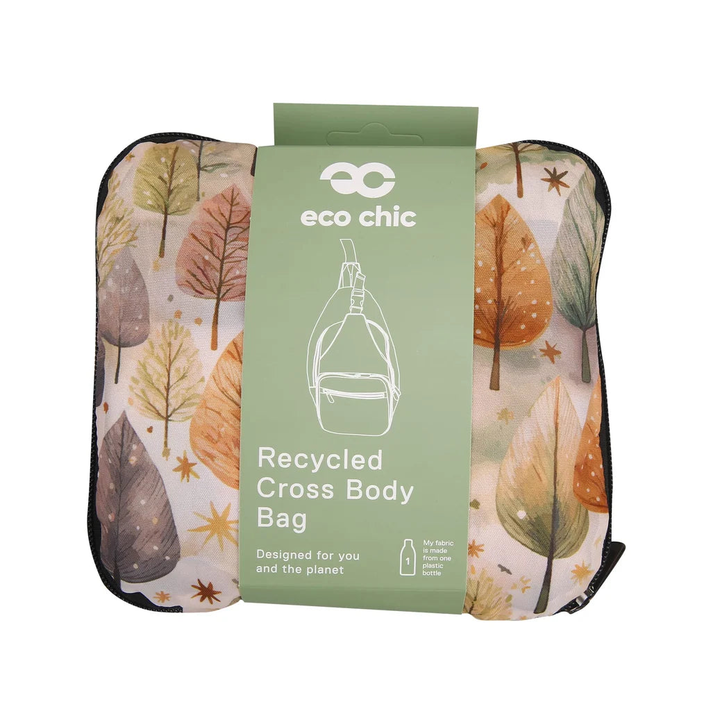 Eco Chic lightweight foldable crossbody sling bag featuring warm autumnal Rhythm of Trees pattern and black webbing strap