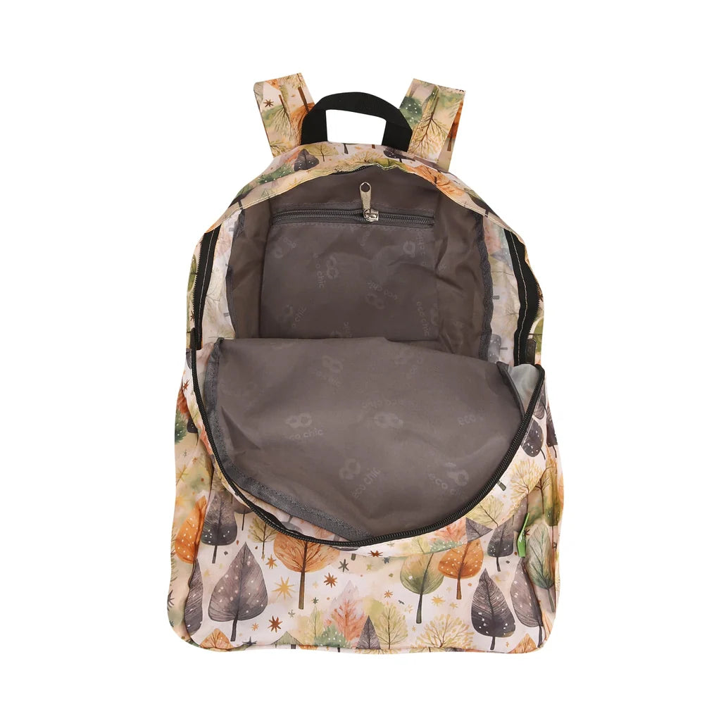 Eco Chic lightweight foldable backpack featuring illustrated Rhythm of Trees pattern in warm autumnal tones