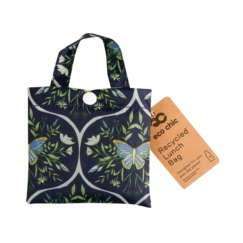 Eco Chic lightweight foldable reusable shopping bag featuring blue butterflies and botanical trellis pattern on navy fabric