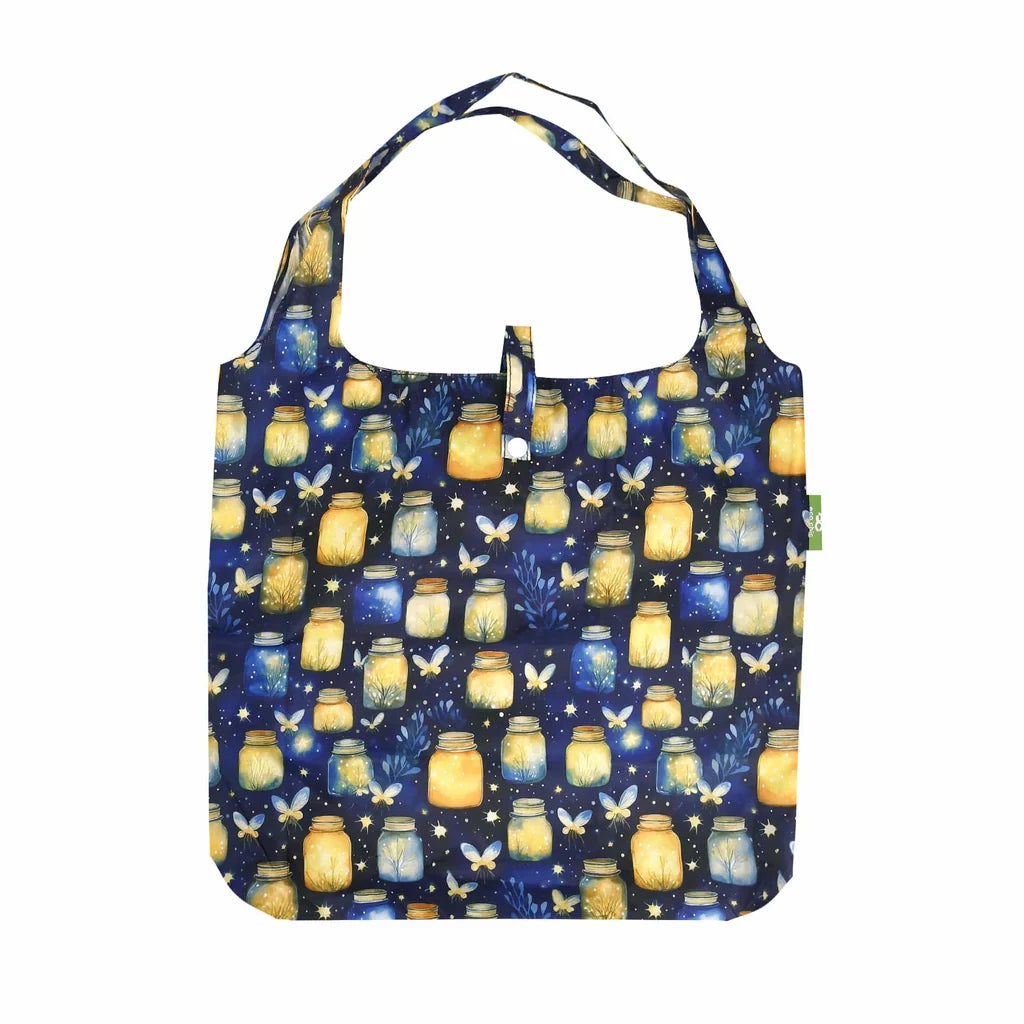 Eco Chic lightweight foldable reusable shopping bag featuring glowing jars and fireflies pattern on navy blue fabric
