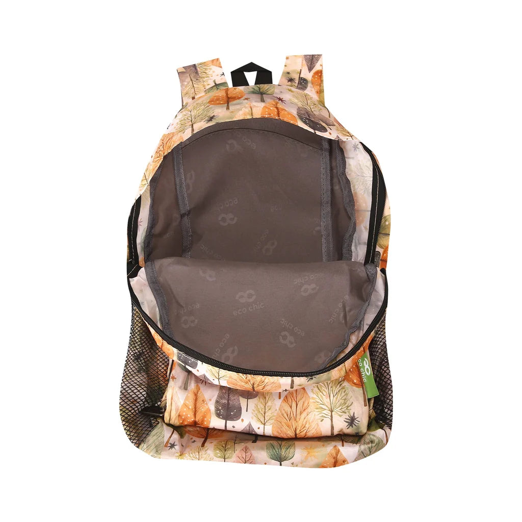 Eco Chic lightweight foldable mini backpack featuring warm autumnal Rhythm of Trees pattern and side mesh pockets