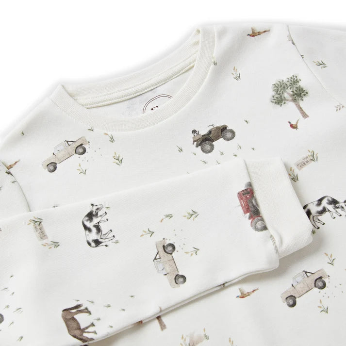 Eleanor Charles On The Farm print organic cotton pyjamas featuring red tractors and farm animals