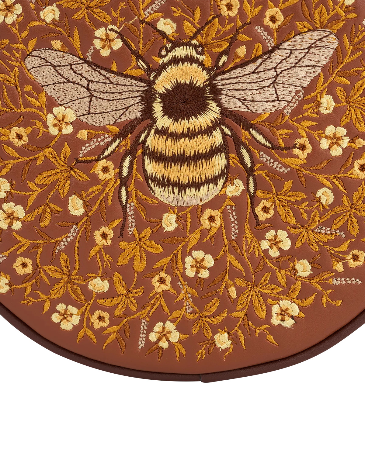 Fable Bumble Circle Bag in tan faux leather featuring detailed embroidered bee and floral pattern