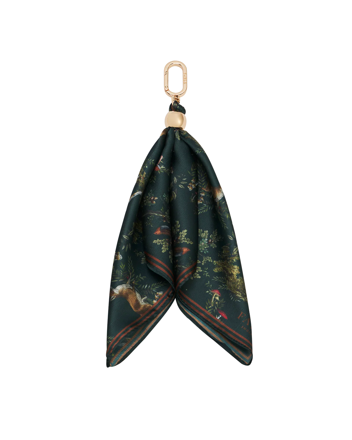 Fable Into the Woods Scarf Bag Charm attached to a brown leather handbag showing gold clip and printed scarf