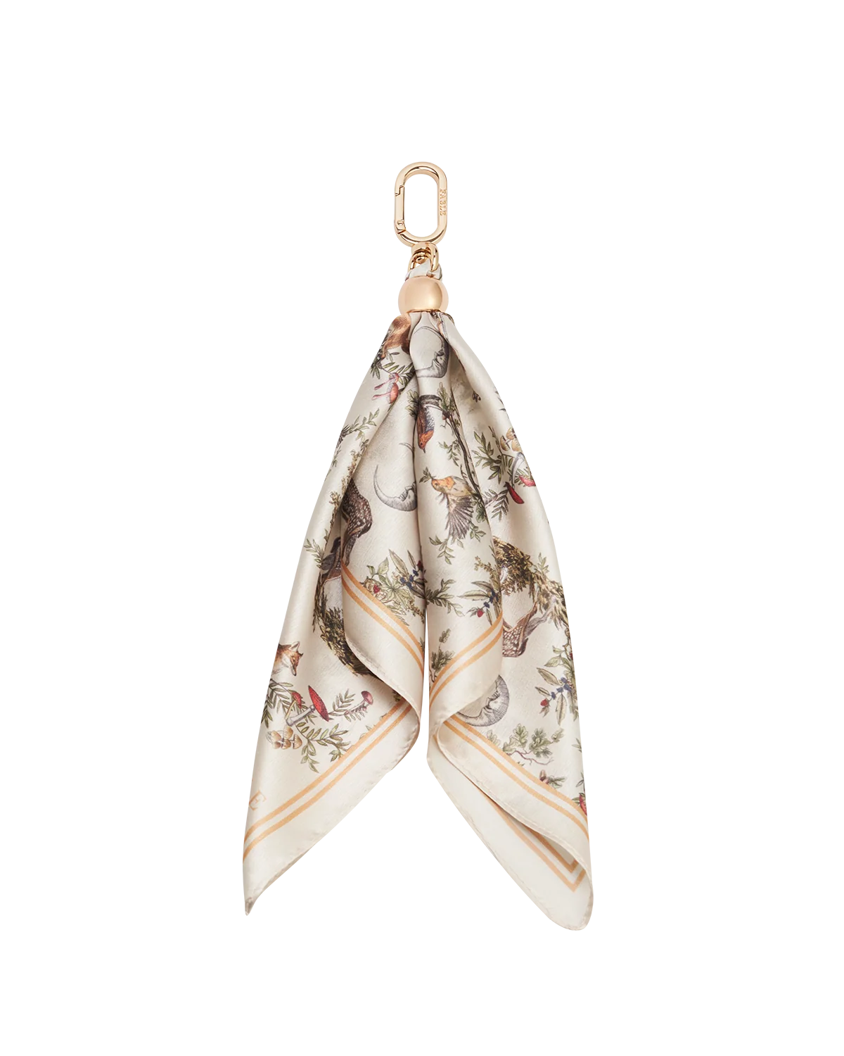 Fable Into the Woods Scarf Bag Charm attached to a brown leather handbag showing gold clip and printed scarf