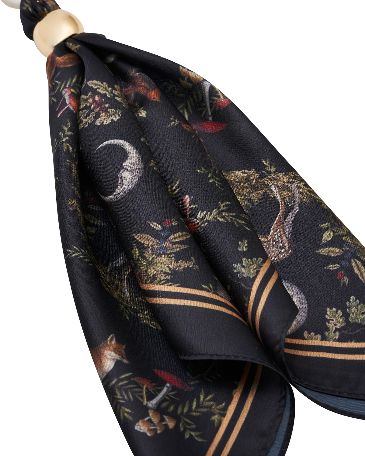 Fable Into the Woods Scarf Bag Charm attached to a brown leather handbag showing gold clip and printed scarf