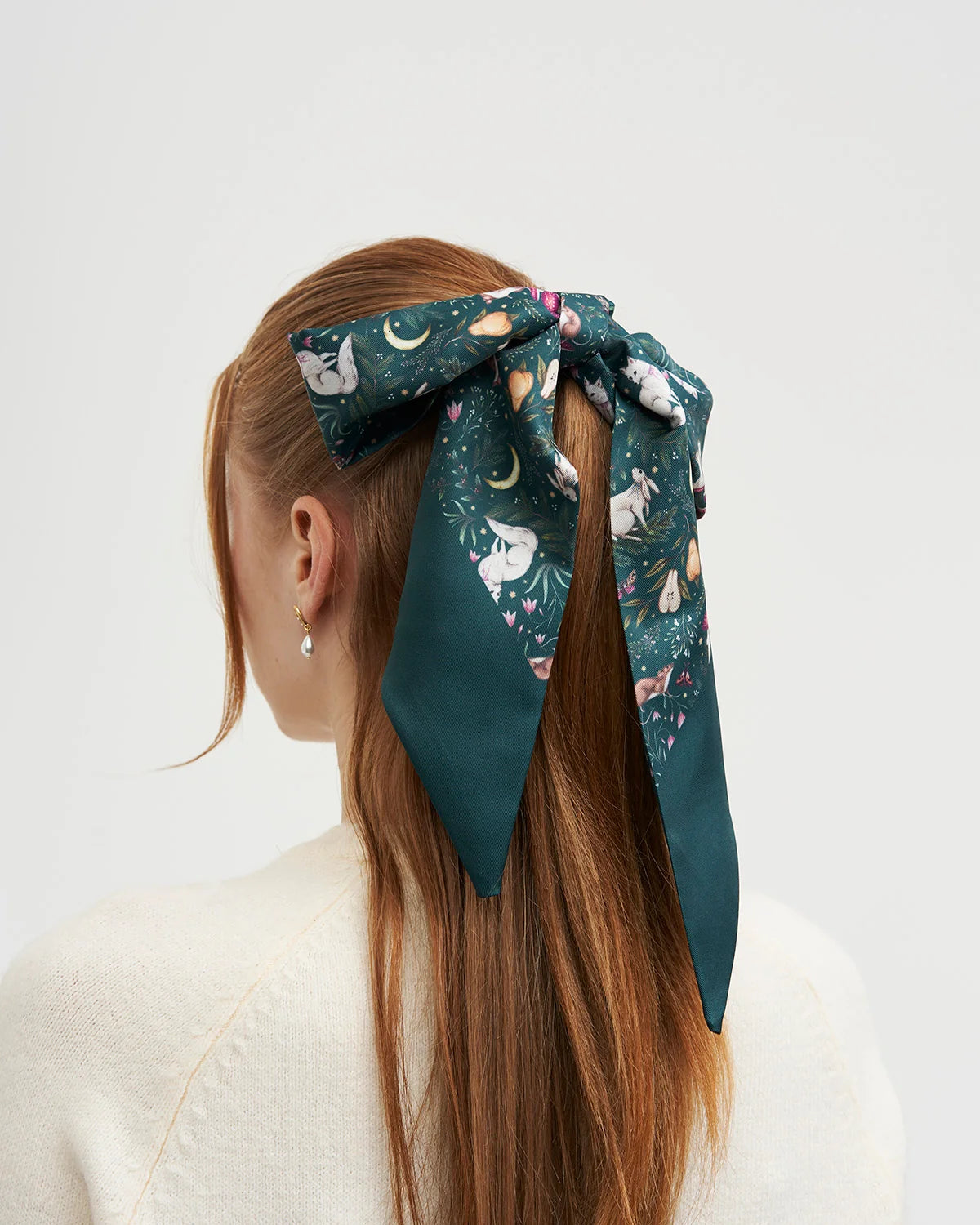Fable Niva Skinny Scarf in Forest Green tied in hair featuring Catherine Rowe woodland animal print