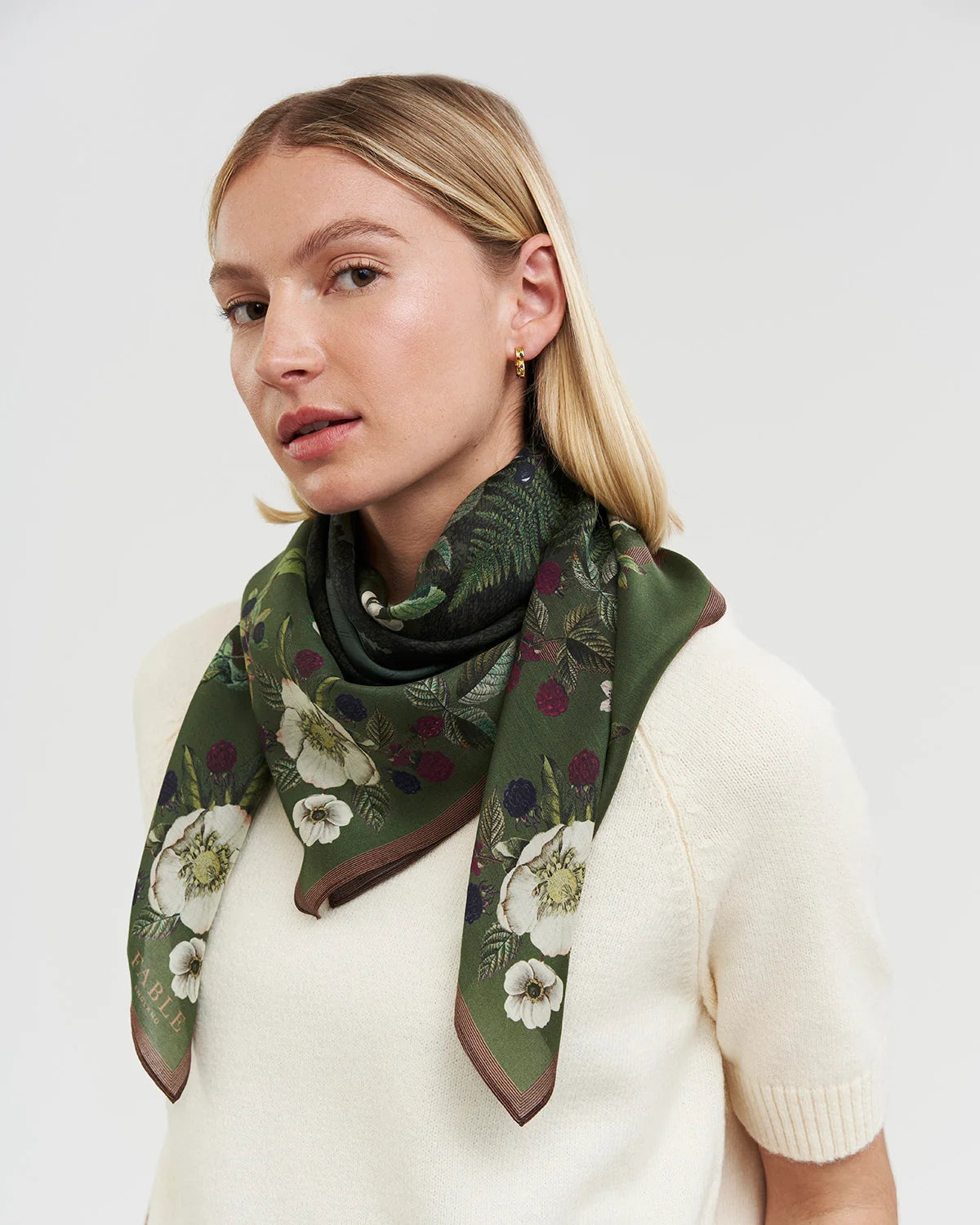 Fable Orla Narrative Medium Square Scarf in khaki tied round models neck
