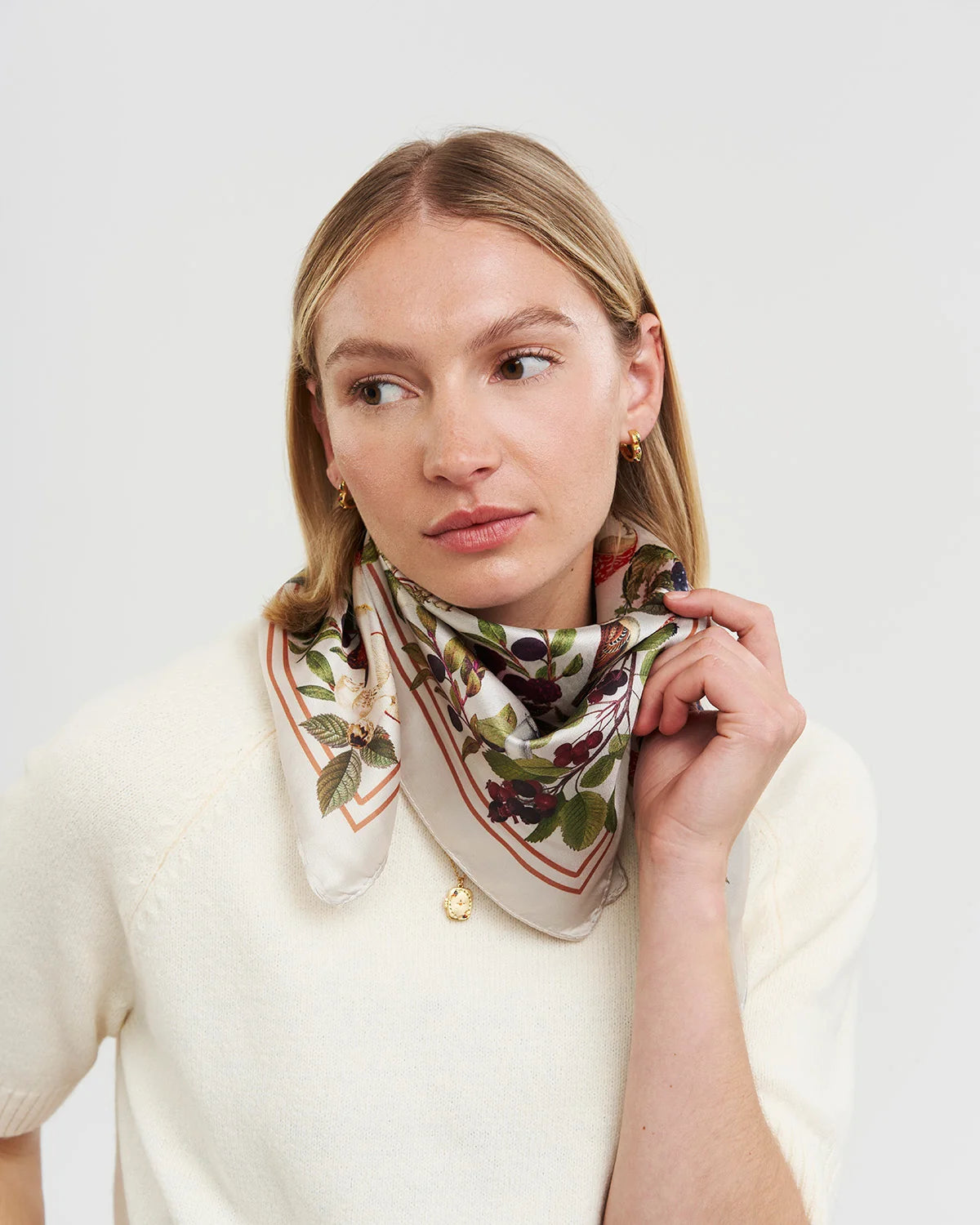 Orla Square Scarf in burgundy featuring woodland animal and mushroom print tied around model's neck