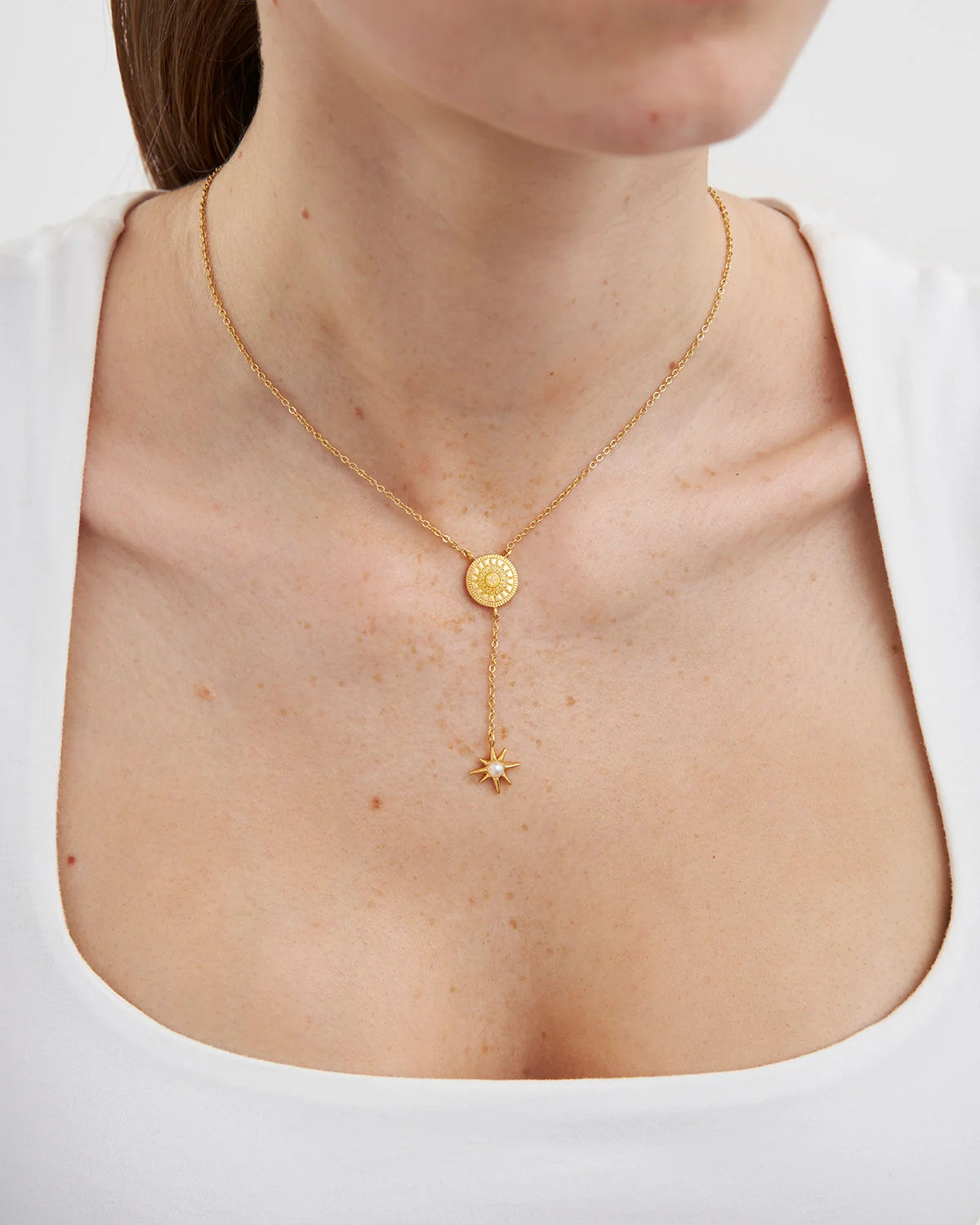 Fable Sun Lariat Necklace in Gold featuring sun pendant and star charm lariat drop