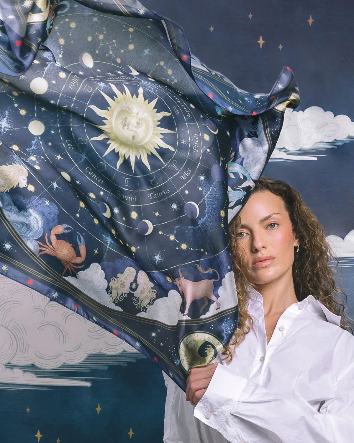 Fable Zodiac Square Scarf in Navy featuring illustrated zodiac signs and celestial sun artwork