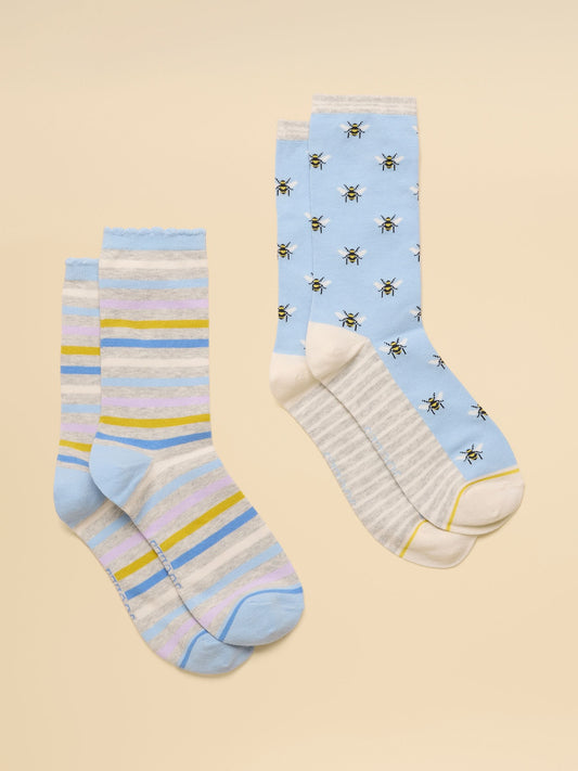 Two pairs of Joules women's cotton-blend crew socks with colourful intarsia patterns and ribbed cuffs displayed against a plain background.
