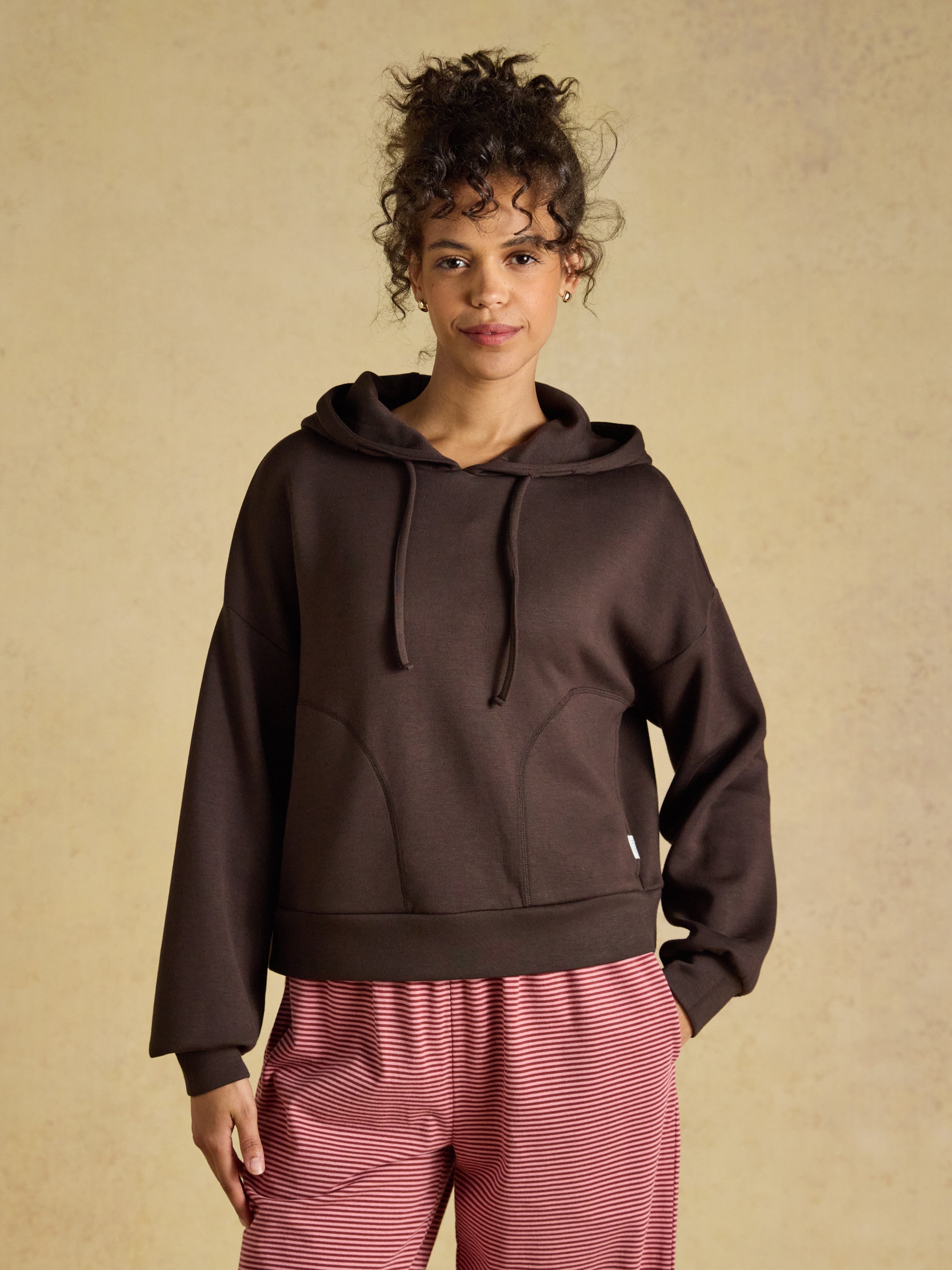 Joules Women's Soft Hoodie in a casual relaxed fit showing hood drawcords and front pockets