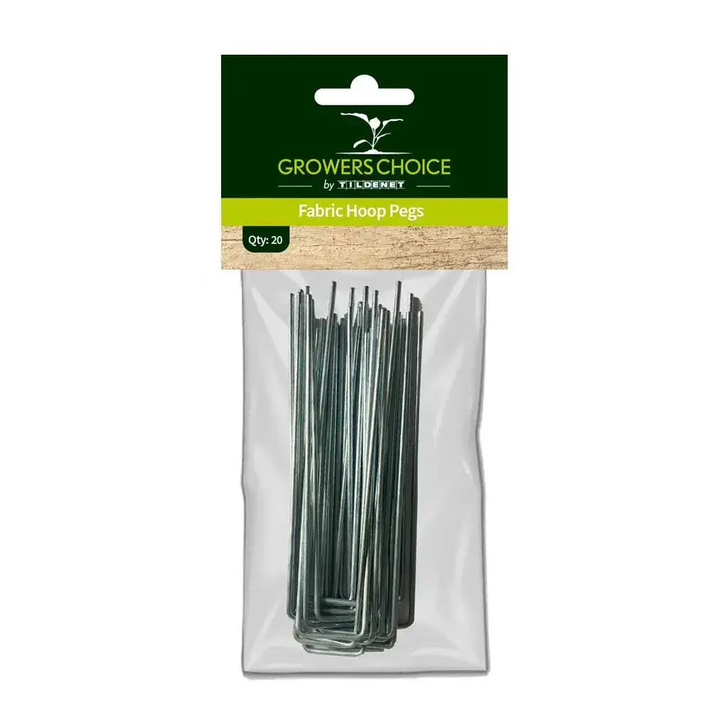 Growers Choice metal U-shaped fabric hoop pegs securing white horticultural plant protection fleece into garden soil