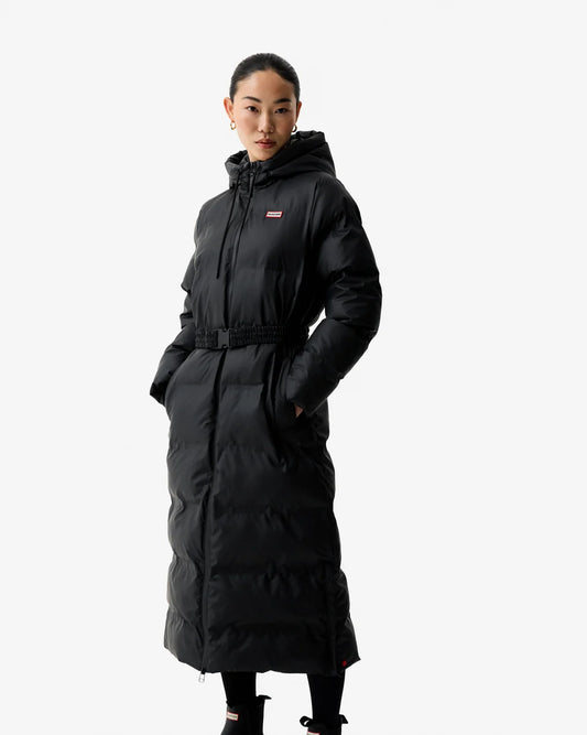 Women wearing the Hunter Hutchison Sonic Long Women's Puffer Jacket in Black with hood up.