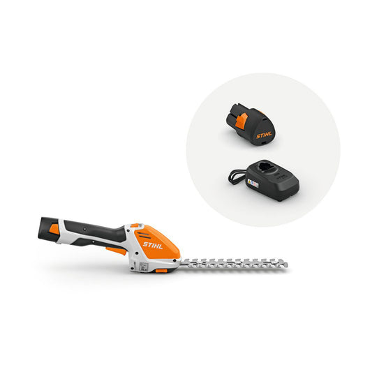 STIHL HSA 26 cordless garden shears set with AS 2 battery, charger, grass blade, and shrub trimmer attachment.