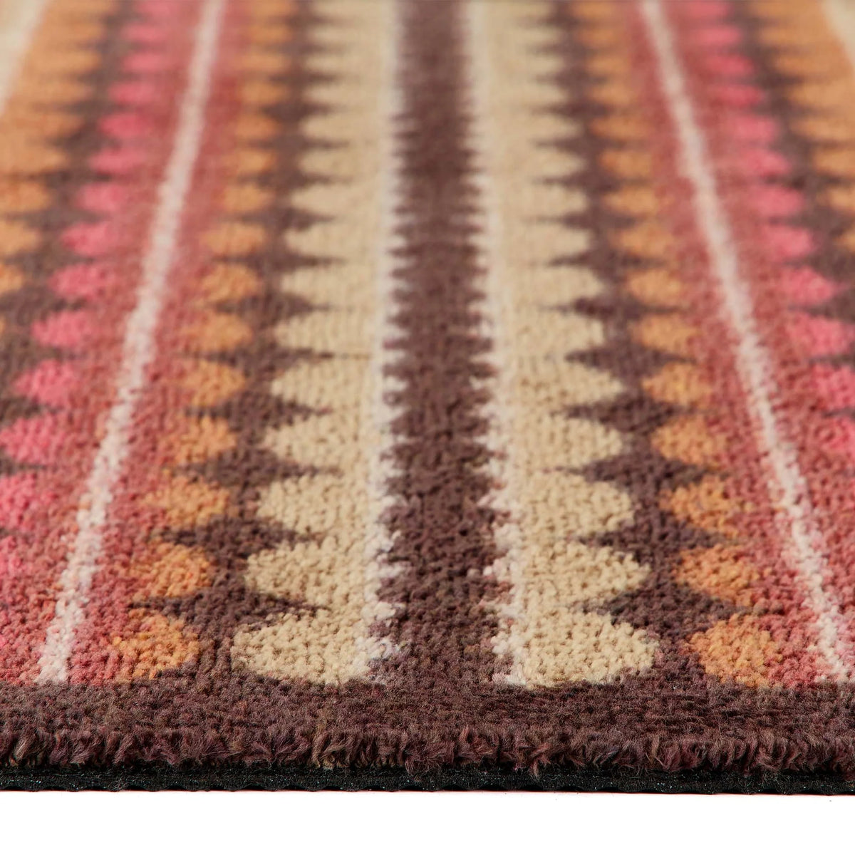 Hug Rug Beady Stripe Earth washable runner mat with non-slip backing laid on a wooden kitchen floor