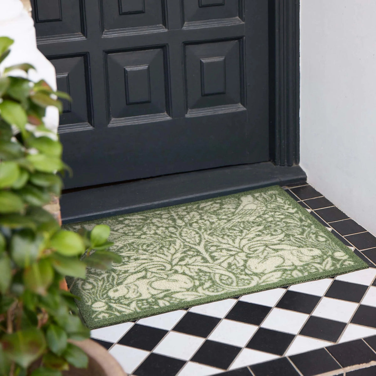 Hug Rug x Morris and Co Brer Rabbit Green outdoor doormat with botanical and rabbit pattern