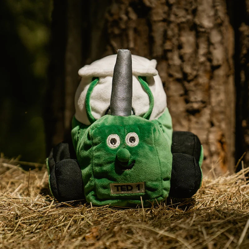 Soft green Tractor Ted plush toy sitting upright with embroidered details