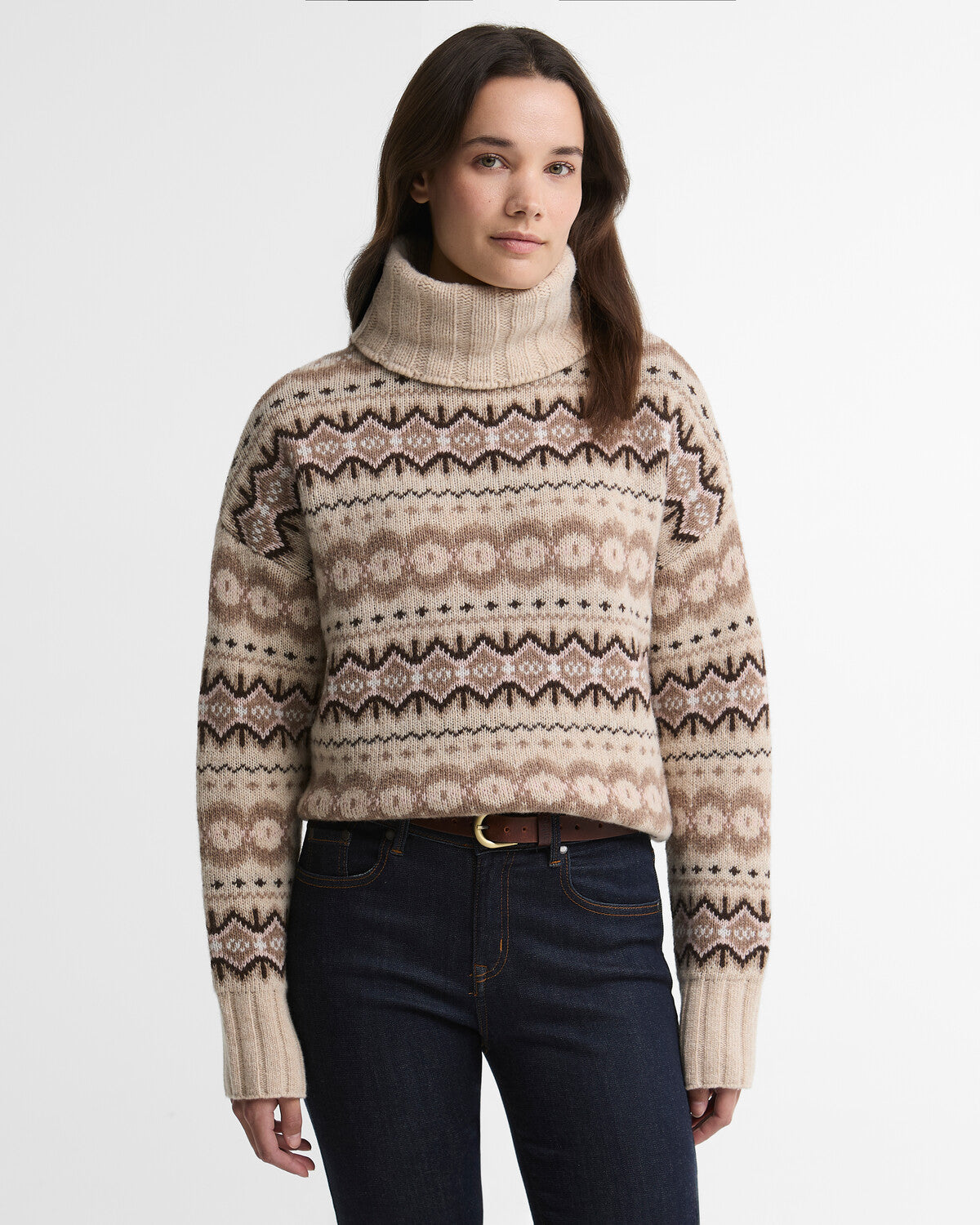 Woman wearing a Barbour Helen wool-blend roll neck jumper featuring a traditional Fair Isle knit pattern.