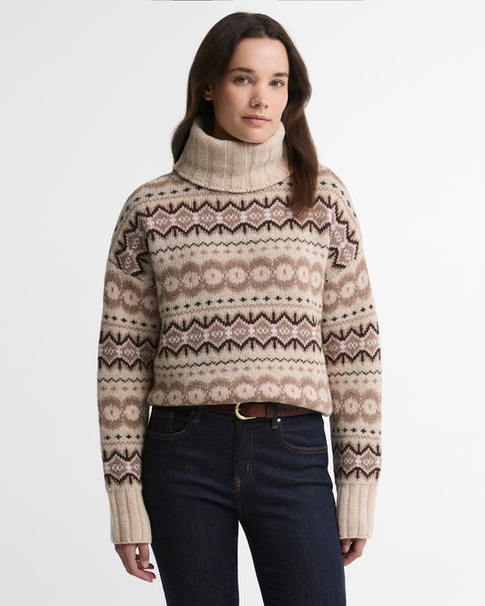 Woman wearing a Barbour Helen wool-blend roll neck jumper featuring a traditional Fair Isle knit pattern.