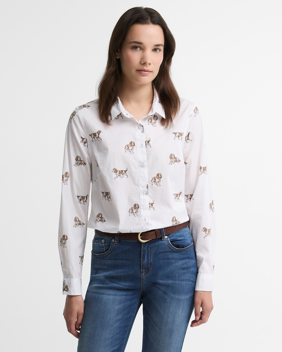 Woman wearing a white Barbour Brambles fitted cotton shirt with a high collar stand and subtle branded metal detailing on the back neck.