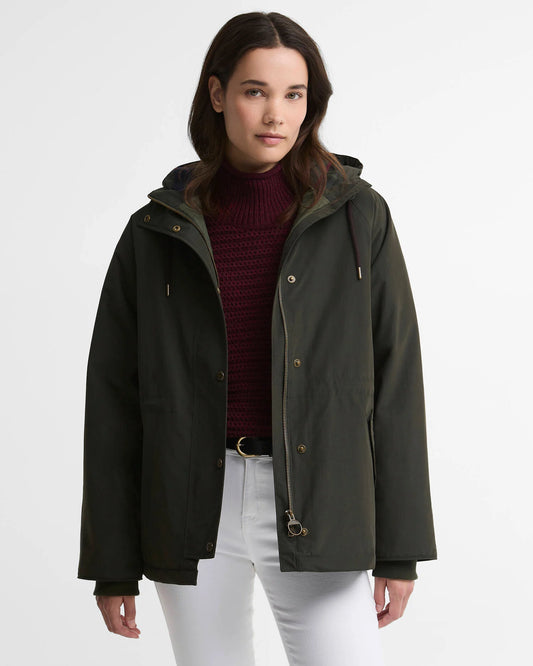 Woman wearing the Barbour Hester Women's Waterproof Jacket with hood up and hand in envelope pocket.