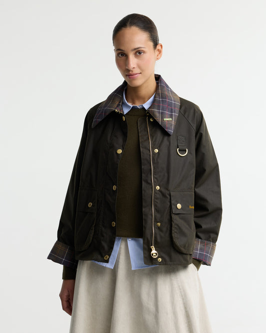 Barbour Womens Icons Tartan Collar Spey Waxed Jacket in 6oz waxed cotton, featuring front patch pockets, brass studs and a classic cord collar.