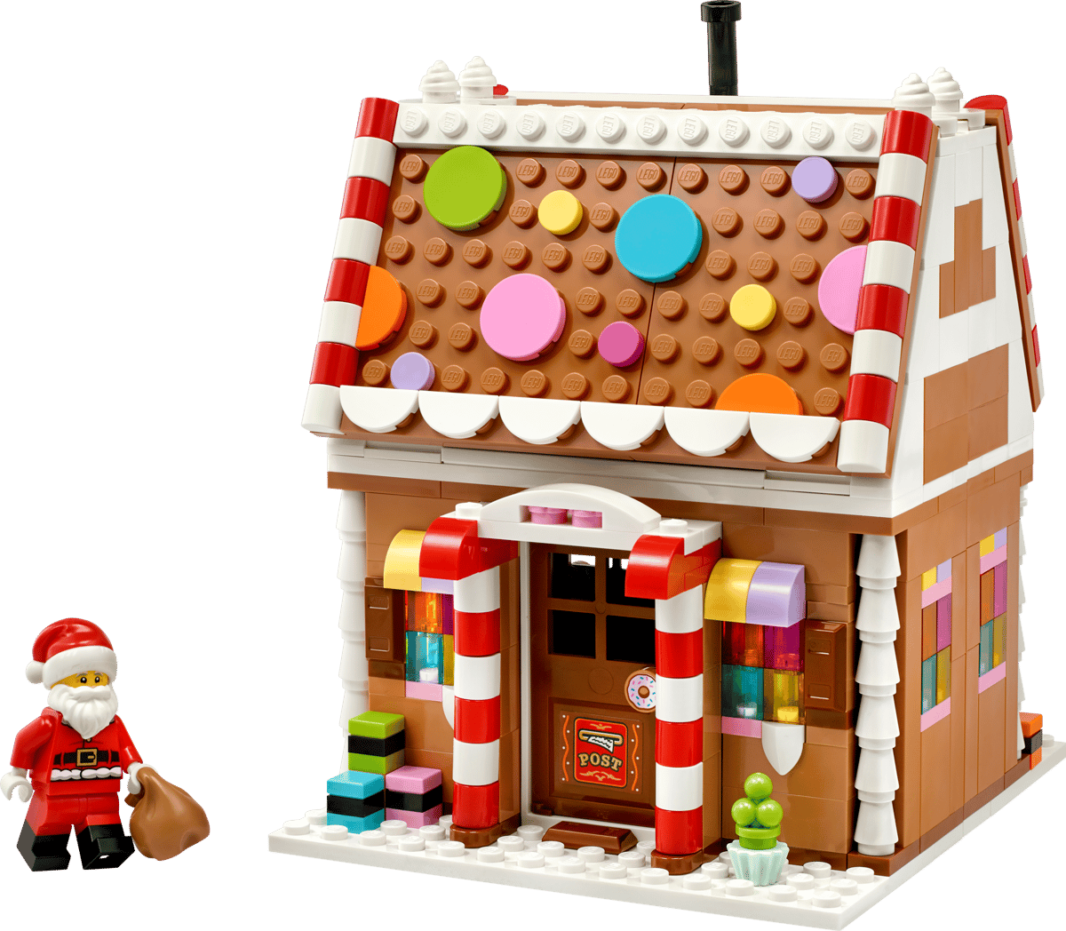LEGO Festive Gingerbread House 40809 shown built alongside a Santa Claus minifigure.