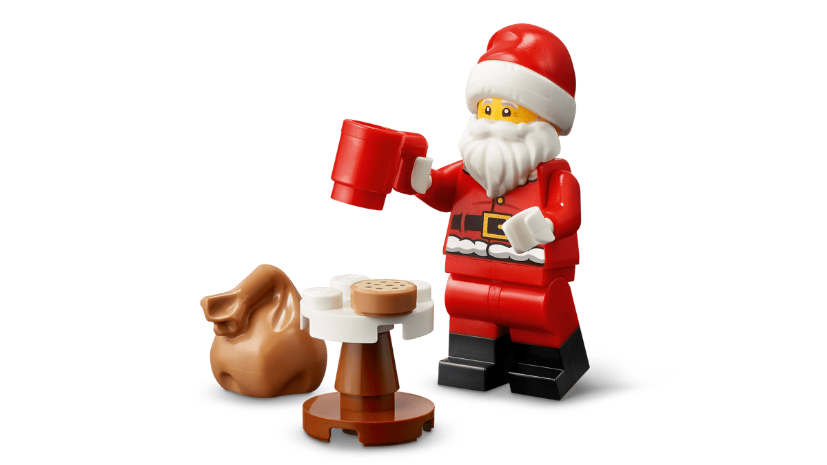 LEGO Festive Gingerbread House 40809 shown built alongside a Santa Claus minifigure.
