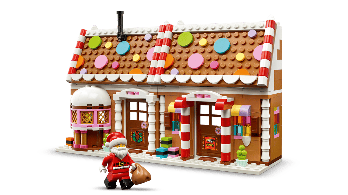 LEGO Festive Gingerbread House 40809 shown built alongside a Santa Claus minifigure.