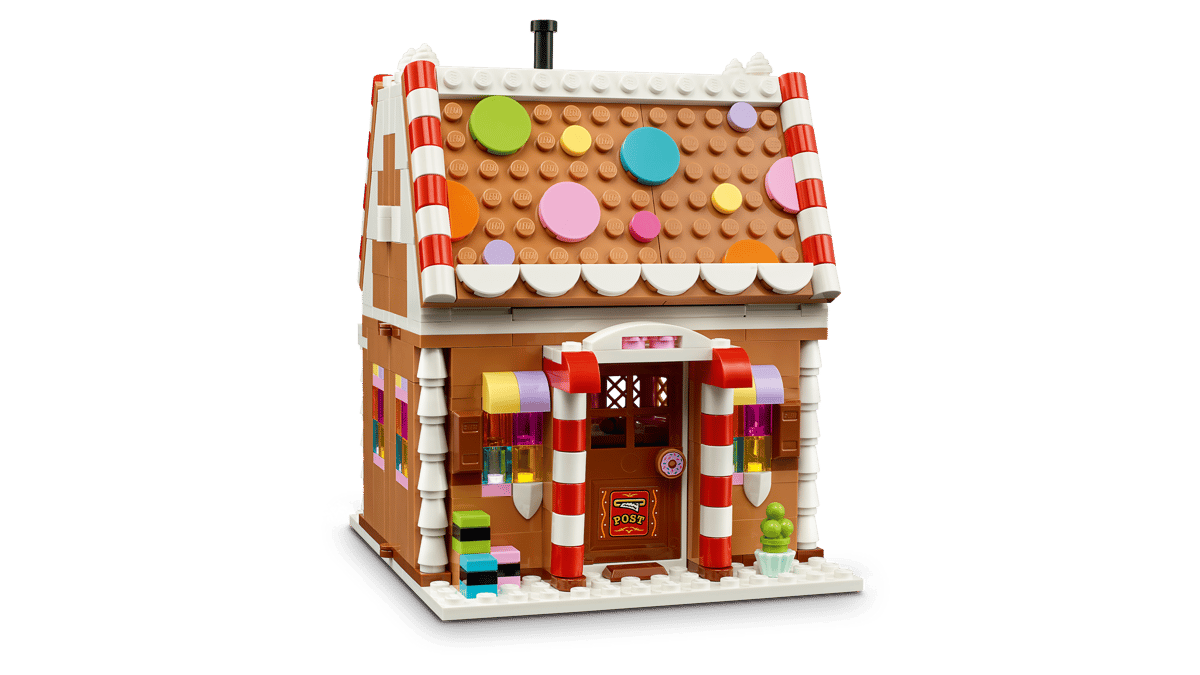 LEGO Festive Gingerbread House 40809 shown built alongside a Santa Claus minifigure.