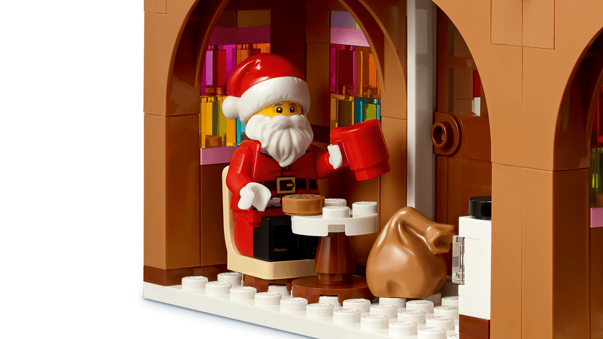 LEGO Festive Gingerbread House 40809 shown built alongside a Santa Claus minifigure.