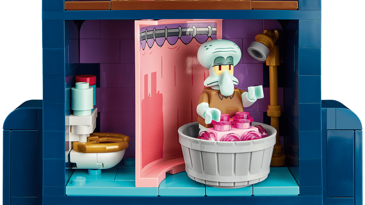 LEGO Icons SpongeBob SquarePants Bikini Bottom 11386 set showing pineapple home, Squidward moai house, Patrick rock, and minifigures