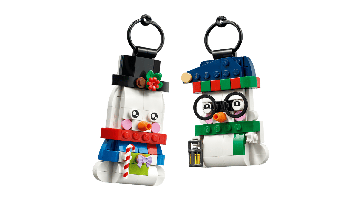 Two buildable LEGO Snowman Ornaments featuring top hat, glasses, lantern, and gift box accessories.