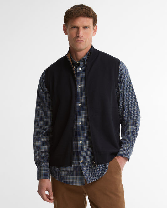 Man wearing the Barbour Marcus Men's Gilet over a shirt showing the zip fastening and knitted welt pockets.