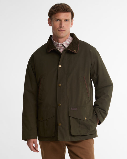 Front view of the Barbour Bromfield Men's Waterproof Jacket, highlighting its longline fit, needlecord collar, and pleated pocket details.