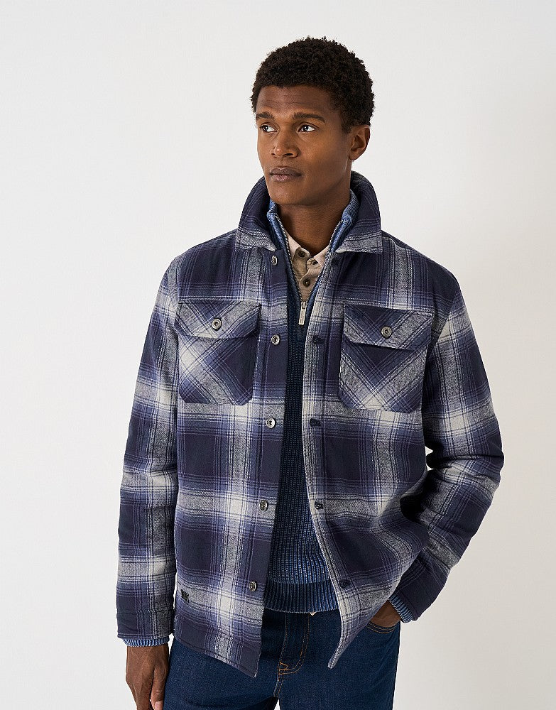 Crew Clothing Borg Lined Check Flannel Shacket featuring a heritage check pattern, cosy borg lining, chest pockets, and branded metal buttons.